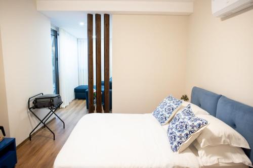Ένα ή περισσότερα κρεβάτια σε δωμάτιο στο Terra'Vista Apartments