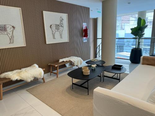 a living room with a couch and a table at Guemes Hotel & Spa in Salta