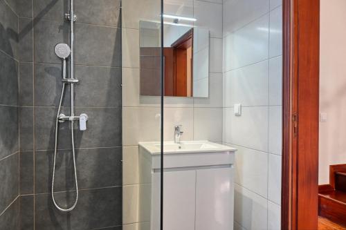 a bathroom with a shower and a sink at Freitas Paradise, a Home in Madeira in Ponta do Sol