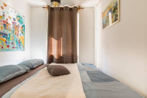a bedroom with two beds and a window at Apartments with WiFi Zagreb - 21954 in Zagreb