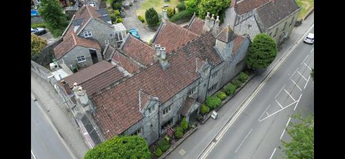 an aerial view of an old building on a street at The Old Manor House Hotel in Keynsham
