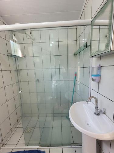 a bathroom with a shower and a sink at Casa da Neia in Paraty