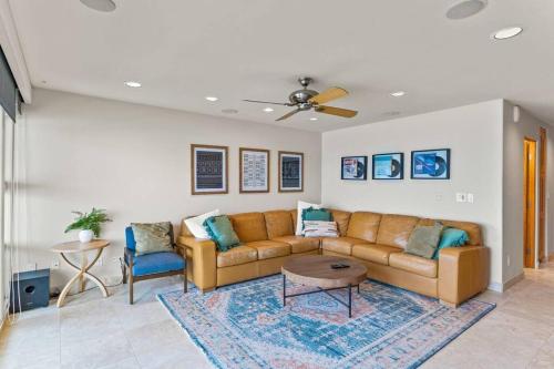 a living room with a couch and a table at A Wave From It All in Carlsbad