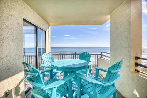 a table and chairs on a balcony with the ocean at Oceanfront 3br/2ba Dog Friendly in Myrtle Beach