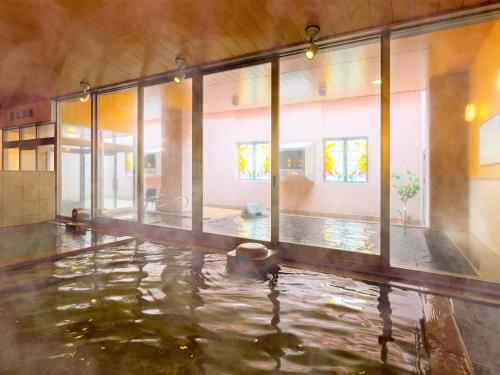 an empty room with a pool of water at Hotel WBF Grande Asahikawa in Asahikawa