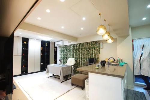 a kitchen with a sink and a table at TOKYOGUEST日本橋 in Tokyo