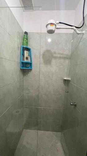 a bathroom with a shower with a glass door at apartamento entero en santa Gema interior 202 in Medellín