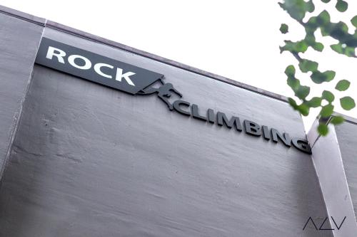a sign for rock climbing on the side of a building at Urban Suites, Signature Collection by Stellar ALV in Jelutong