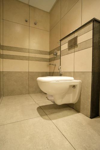 a bathroom with a sink and a mirror at Sulu Residency in Ernakulam