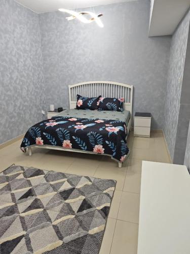a bedroom with a bed and a rug at Ajman preal modren 1 bed room in Ajman 