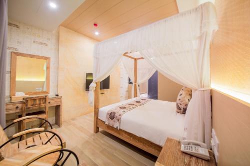 Postel nebo postele na pokoji v ubytování Oceanic Pearl Resort II