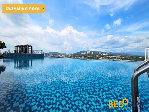 a large swimming pool with blue water at Cheras Saville Suite walkable MRT Sri Raya for 5Pax in Cheras