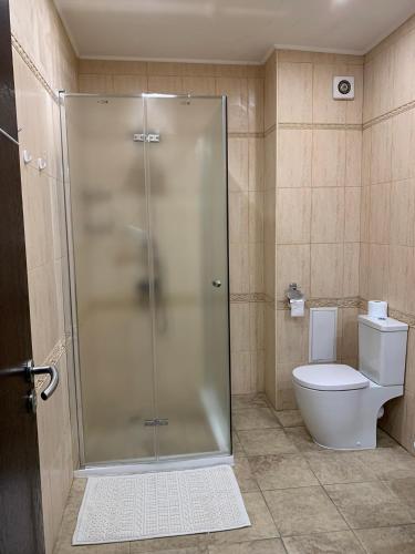 a bathroom with a shower and a toilet at Sea Apartment 3bedrooms in Golden Sands