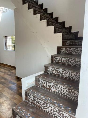 a set of stairs in a house at Indiana home stay in Khajurāho