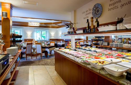 a buffet line with a lot of food on it at Hotel König in Passau