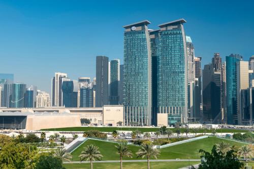 a view of a city skyline with tall buildings at City Centre Rotana Doha in Doha
