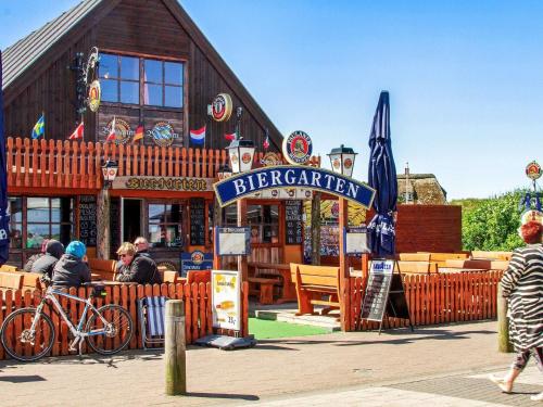 a restaurant with a sign in front of a building at 4 star holiday home in Ulfborg-By Traum in Ulfborg