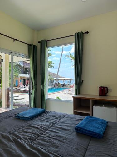 Vuode tai vuoteita majoituspaikassa Sea Shell Beach Resort
