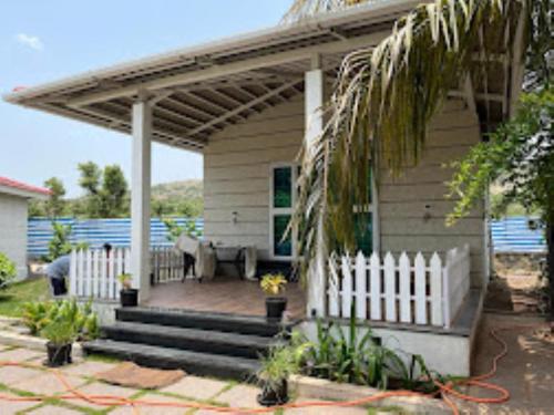 a house with a white fence and a porch at Farm House,Palm Castle , Savarde in Alta