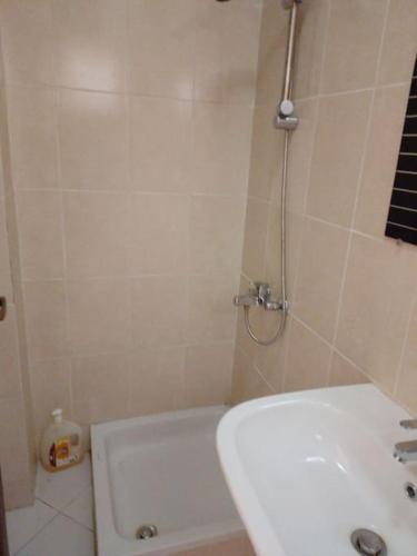 a bathroom with a shower and a toilet and a sink at Mountain view apartment in Makadi Heights in Hurghada