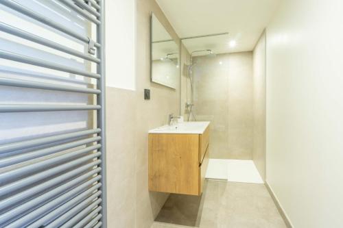 a bathroom with a sink and a mirror at Chalet La Turra, Spa privée in Lanslebourg-Mont-Cenis