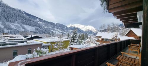 a balcony with a view of a snow covered mountain at Haus Tisch in Schruns-Tschagguns