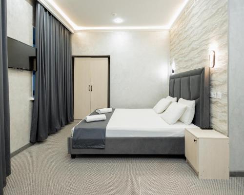 Postel nebo postele na pokoji v ubytování "Rush Hotel"