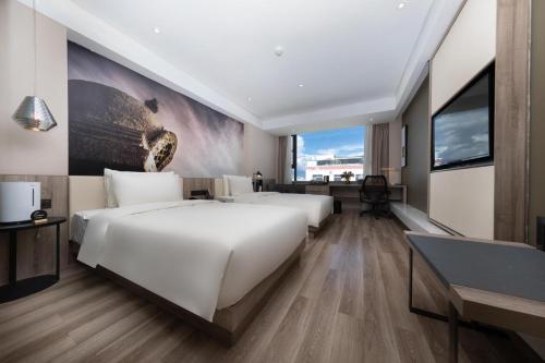 Μια τηλεόραση ή/και κέντρο ψυχαγωγίας στο Atour Hotel Potala Palace Lhasa