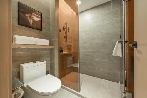 a bathroom with a toilet and a shower at Atour Hotel Beijing Guomao Panjia Yuan in Beijing