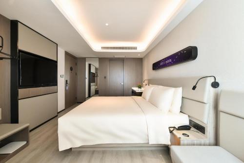 Postel nebo postele na pokoji v ubytování Atour Light Hotel Shenyang High-Speed Railway Station
