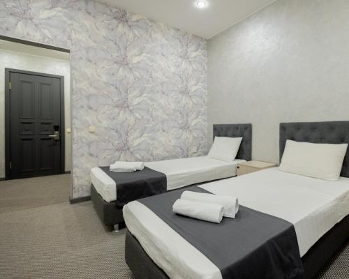 Postel nebo postele na pokoji v ubytování "Rush Hotel"