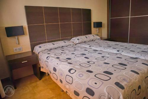 a bedroom with a large bed with a large headboard at Albir Palace in Albir