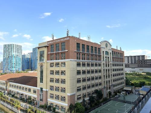 an aerial view of a building in a city at Shore Residences MOA Dynastel Staycation in Manila