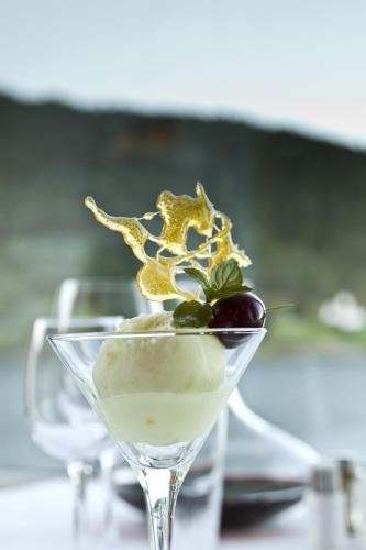 a dessert in a martini glass with a cherry at Kviknes Hotel in Balestrand