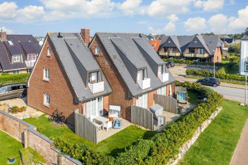 an aerial view of a row of houses at Am Kurpark App 4 in Wenningstedt