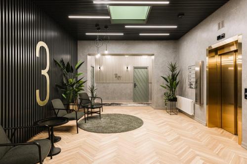 an office with chairs and a sign on the wall at Konventa Sēta Hotel Keystone Collection in Riga