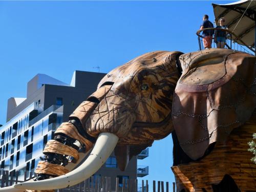 a statue of an elephant with people on top of it at ibis Nantes Saint Herblain in Saint-Herblain