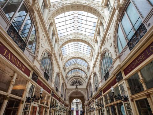 a large building with windows and a ceiling at Ibis Nantes la Beaujoire Parc Expo in Nantes