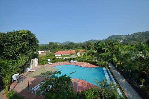 an overhead view of a swimming pool at a resort at BENTO CORBETT WOODS RESORT in Jhirna