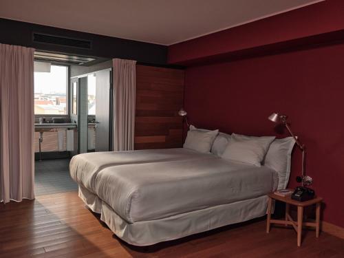 a bedroom with a large bed in a room at Casa Camper Berlin in Berlin