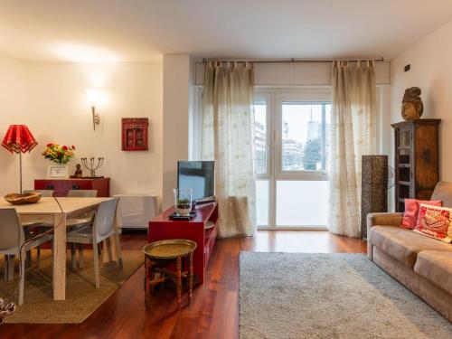 a living room with a couch and a table at Apartment Isola delle Abbadesse by Interhome in Milan