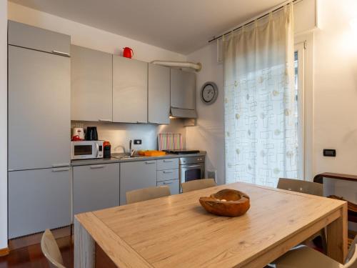 a kitchen with a wooden table with a bowl on it at Apartment Isola delle Abbadesse by Interhome in Milan