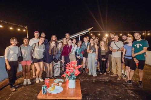a group of people posing for a picture at night at Phong Nha Cherish House in Phong Nha