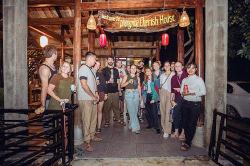 a group of people standing in a doorway at Phong Nha Cherish House in Phong Nha