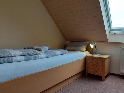 Ένα ή περισσότερα κρεβάτια σε δωμάτιο στο Feriendomizil Wattwurm Paul