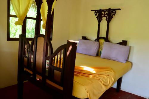a bed in a room with a window at Embe Lodge in Kizimkazi