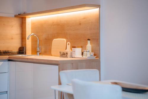 a kitchen with a sink and a counter top at Apartment Frost Bjelasnica in Bjelašnica