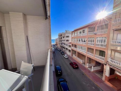 a view of a street from a balcony of a building at Modern and Stylish Apartament sea ​​views in Guardamar del Segura