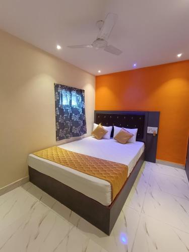 a bedroom with a large bed in a room at Hotel Powai Residency in Mumbai