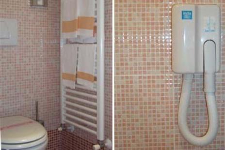 two pictures of a bathroom with a toilet in a bathroom at Hotel Europa in San Bartolomeo al Mare